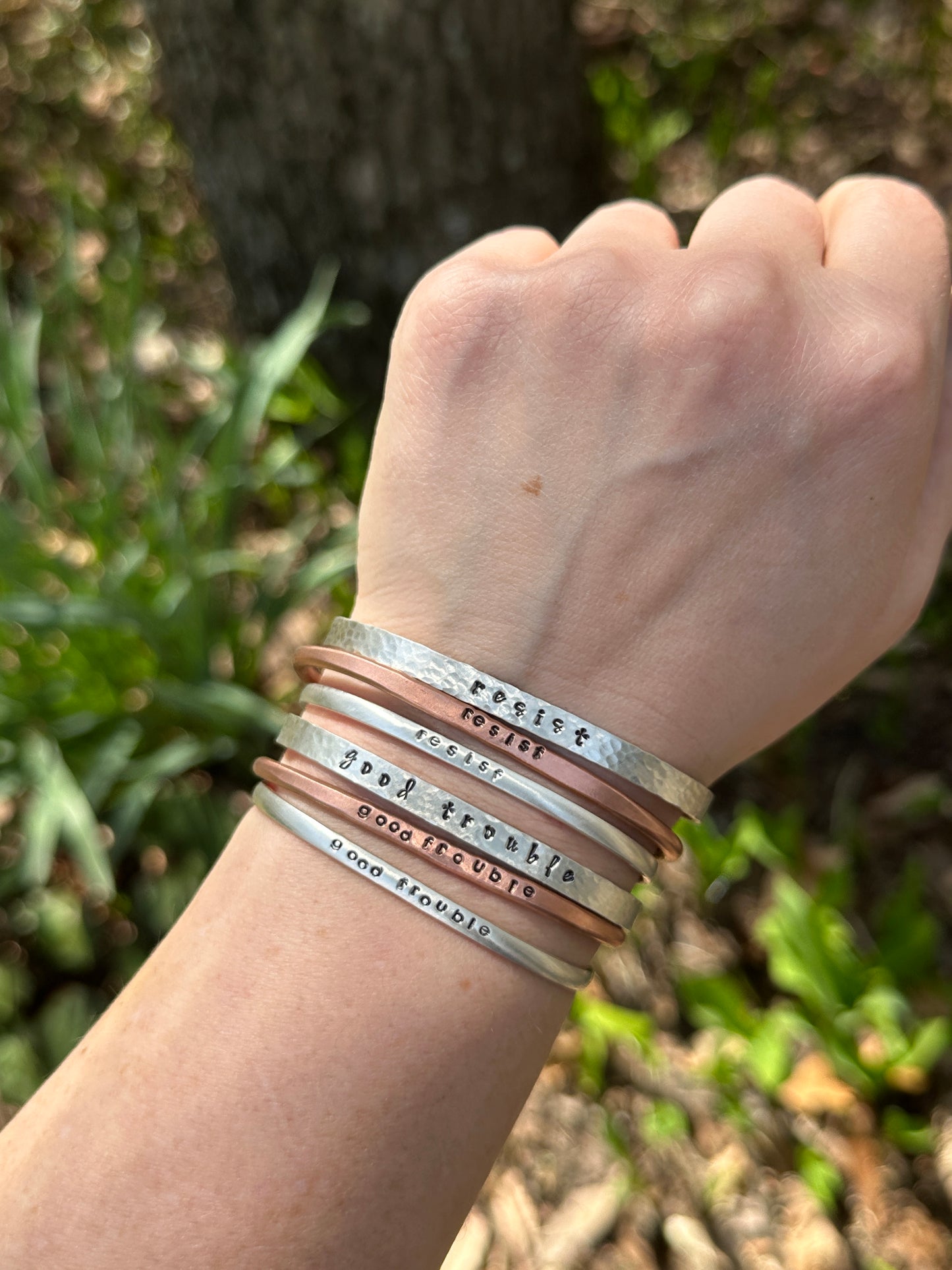 good trouble // resist // hands off cuffs