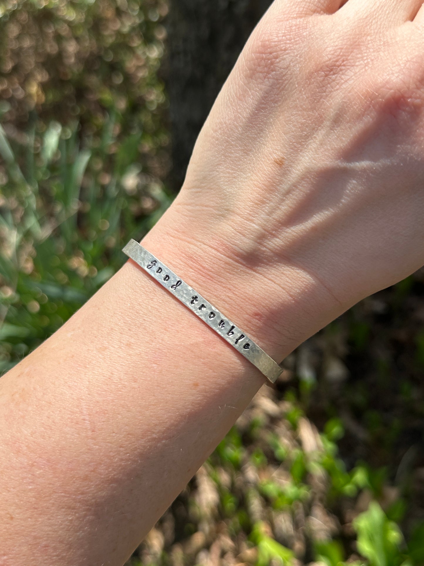 good trouble // resist // hands off cuffs