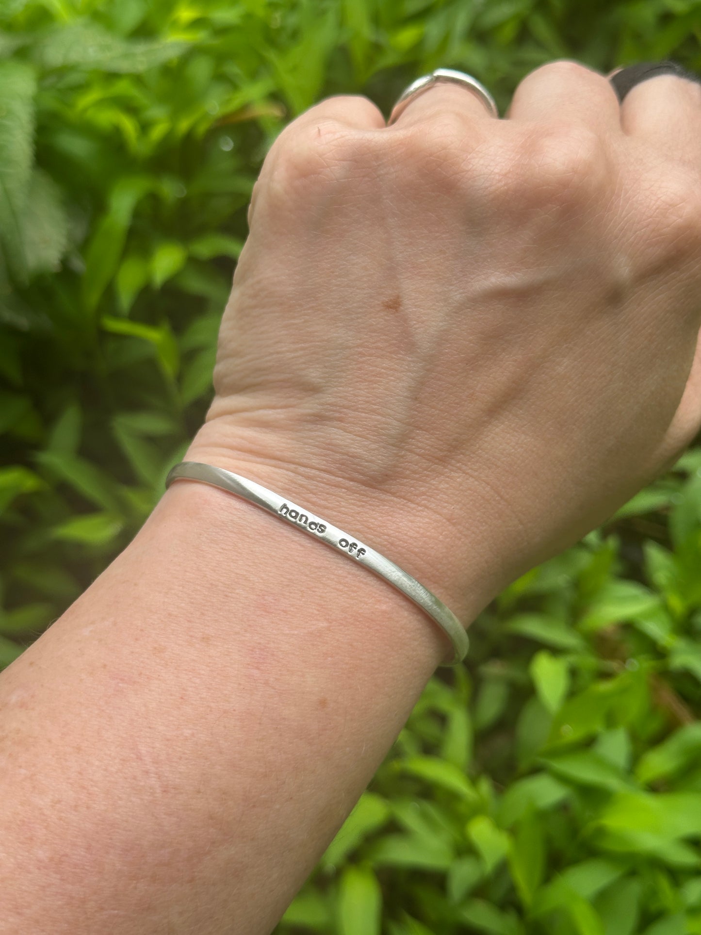 good trouble // resist // hands off cuffs