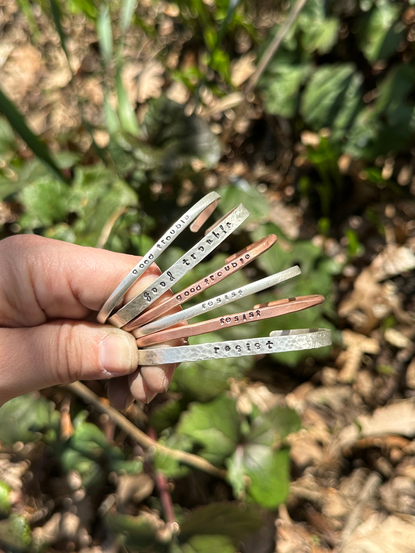 good trouble // resist // hands off cuffs