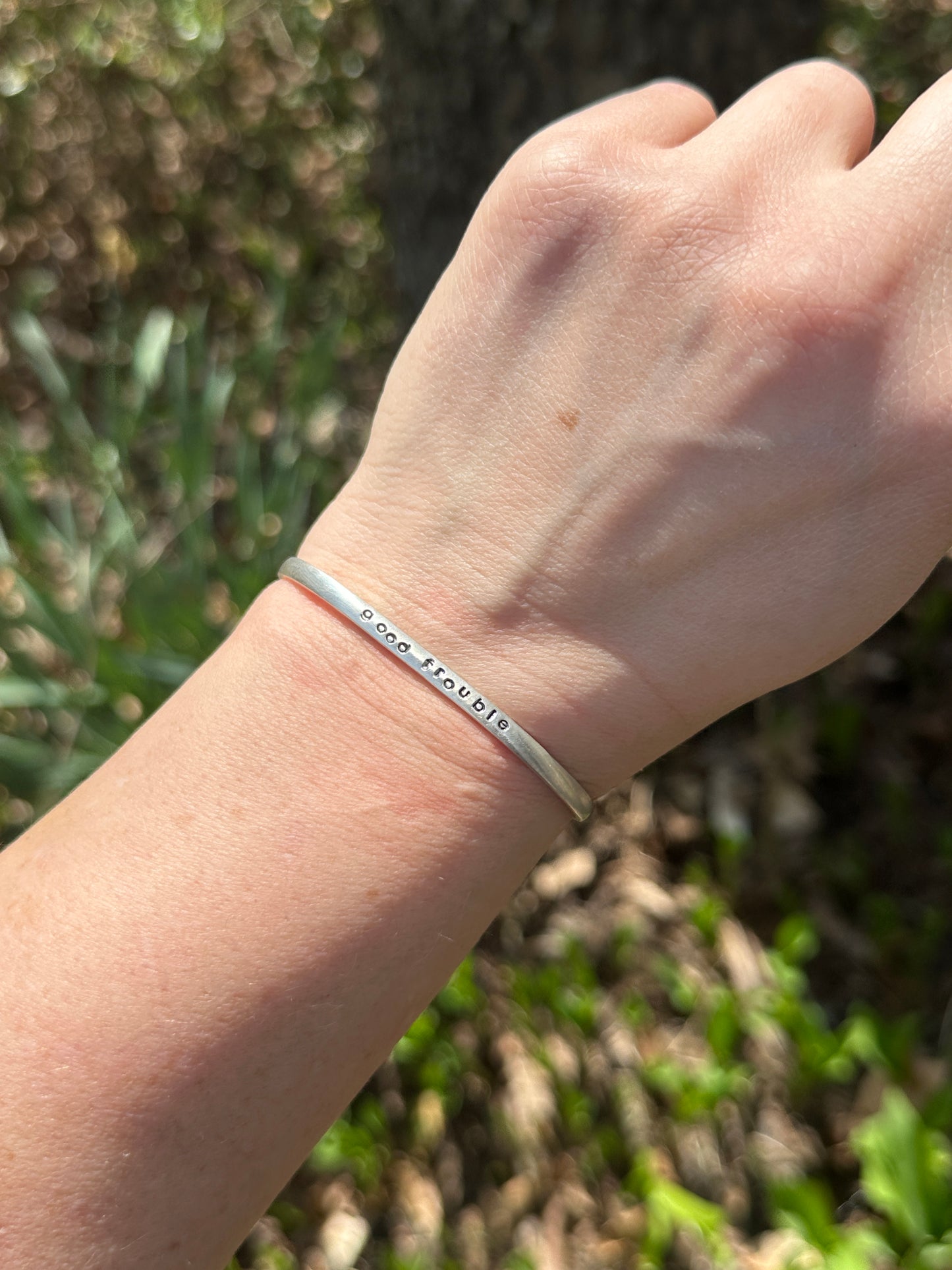 good trouble // resist // hands off cuffs